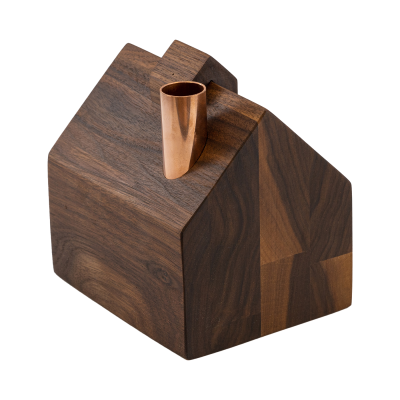 A tiny wooden barn with a cupola and a copper chimney.