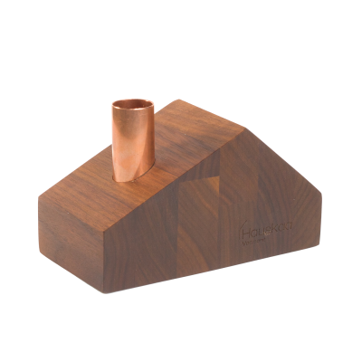 A little wooden mid-century modern ranch house candlestick holder with a copper chimney.
