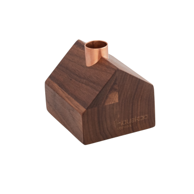 Wooden cabin with a copper chimney in the center of the roof