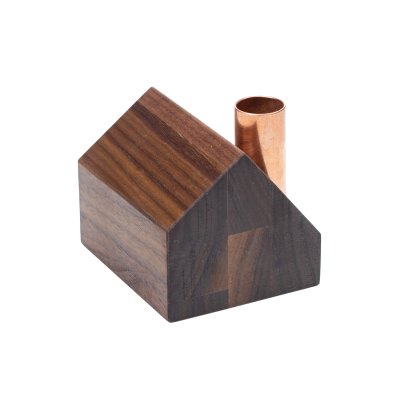 A little decorative saltbox candlestick holder.